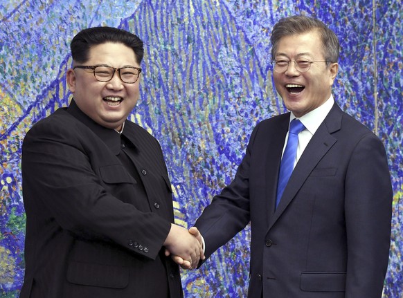 FILE - North Korean leader Kim Jong Un, left, poses with South Korean President Moon Jae-in for a photo inside the Peace House at the border village of Panmunjom in Demilitarized Zone, South Korea on  ...