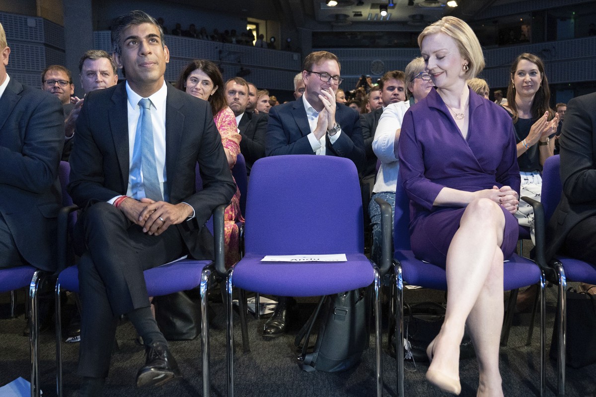 Liz Truss, right, looks across Rishi Sunak at the Queen Elizabeth II Centre in London, Monday Sept. 5, 2022. Britain���s Conservative Party has chosen Foreign Secretary Liz Truss as the party���s new  ...