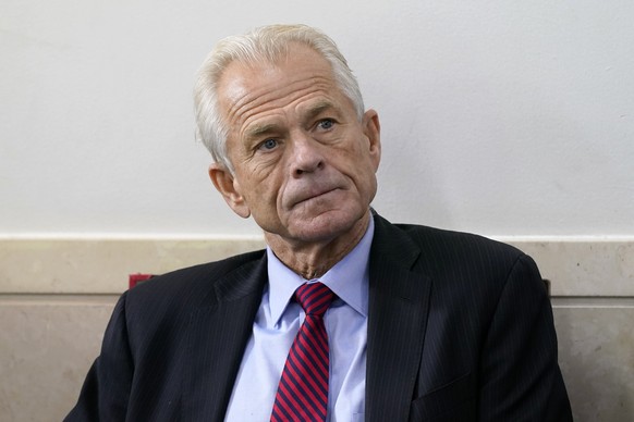 FILE - White House trade adviser Peter Navarro listens as President Donald Trump speaks during a news conference at the White House, Aug. 14, 2020, in Washington. The House committee investigating the ...
