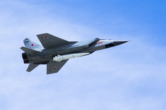 FILE - In this file photo taken on Wednesday, May 9, 2018, a Russian Air Force MiG-31K jet carries a high-precision hypersonic aero-ballistic missile Kh-47M2 Kinzhal during the Victory Day military pa ...