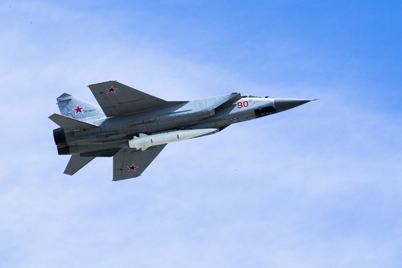 FILE - In this file photo taken Wednesday, May 9, 2018, a Russian Air Force MiG-31K jet carries a high-precision hypersonic aero-ballistic missile Kh-47M2 Kinzhal during the military pa...