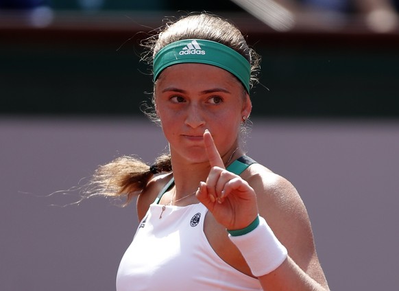 epa06016704 Jelena Ostapenko of Latvia reacts as she plays against Timea Bacsinszky of Switzerland during their womenâs singles semi final match during the French Open tennis tournament at Roland Ga ...