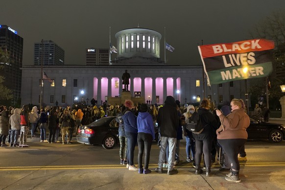 A crowd gathers in front of the Ohio Statehouse during a protest Tuesday, April 20, 2021, in Columbus, Ohio. Earlier Tuesday, police shot and killed a teenage girl in Columbus just as the verdict was  ...