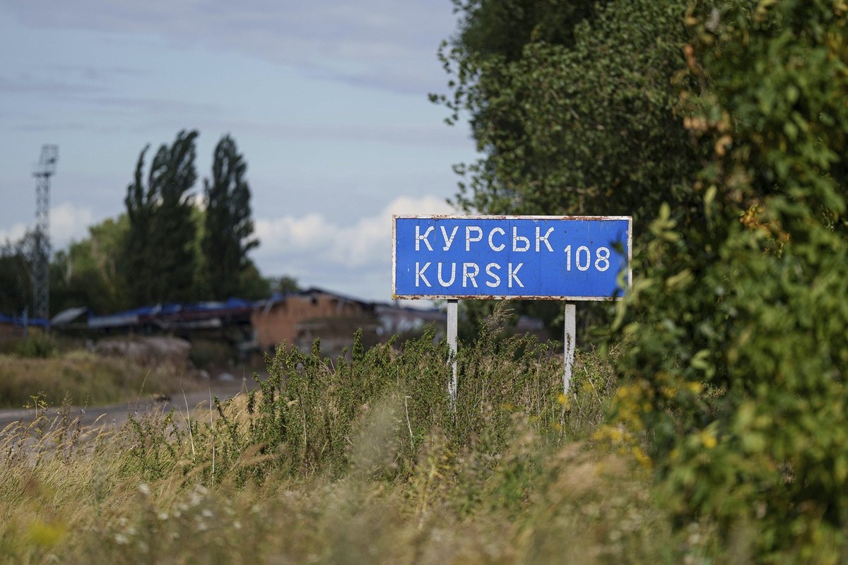 A plate with sign "Kursk 108 km" is seen on the Russian-Ukrainian border in Sumy region, Ukraine, Tuesday, Aug. 13, 2024. (AP Photo/Evgeniy Maloletka)