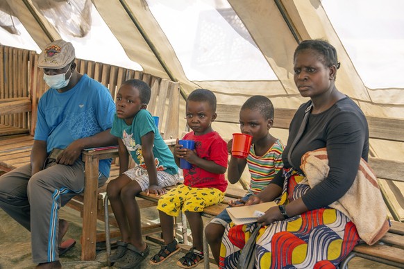 epa10984885 Cholera patients with cups of an oral water solution, as treatment against the disease, at Kuwadzana Poly Clinic in the Kuwadzana township in Harare, Zimbabwe, 19 November 2023. Zimbabwe h ...