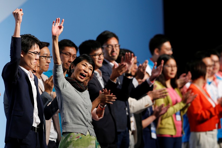 Claudia Mo (2nd L), from Civic party, celebrates after winning a seat in the Legislative Council election, in Hong Kong, China September 5, 2016. REUTERS/Tyrone Siu