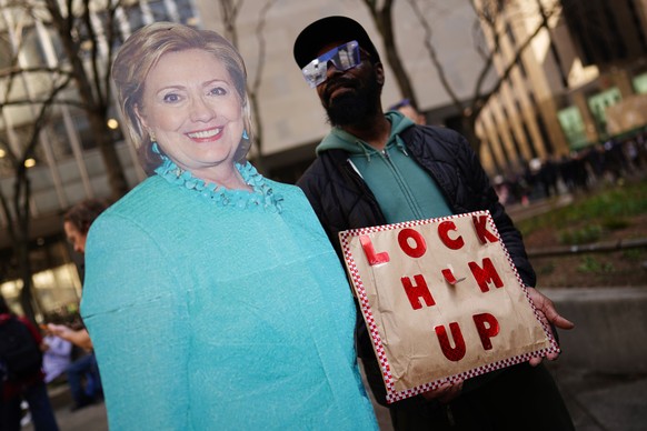 epa10558318 A protester with a Hillary Clinton cutout outside the New York Criminal Court in New York, New York, U.S., April 4, 2023. A Manhattan grand jury voted to indict former President Donald J. Tre...