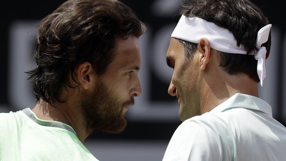 Switzerland&#039;s Roger Federer, right, greets Portugal&#039;s Joao Sousa beating him 6-4, 6-3 at the Italian Open tennis tournament, in Rome, Thursday, May, 16, 2019. (AP Photo/Gregorio Borgia)