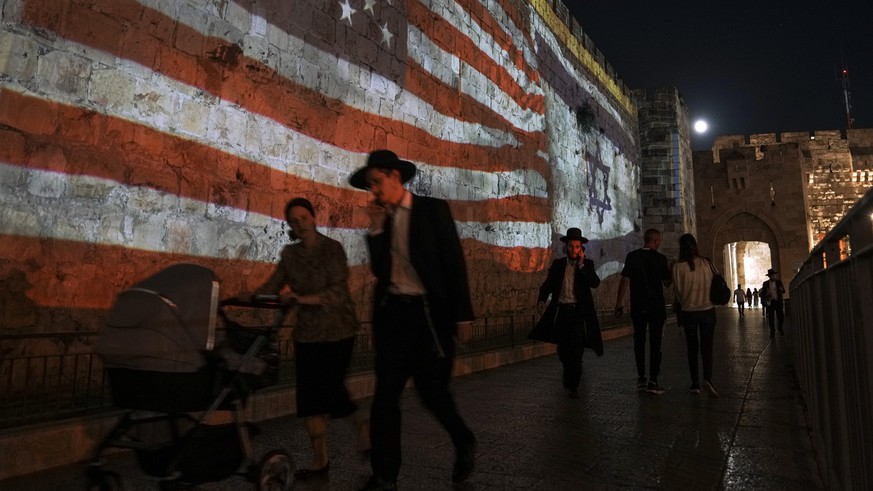 An Image of the U.S. and Israeli flags is projected on the walls of Jerusalem&#039;s Old City in honor of President Joe Biden visit to Jerusalem, Wednesday, July 13, 2022. Biden arrives in Israel on W ...