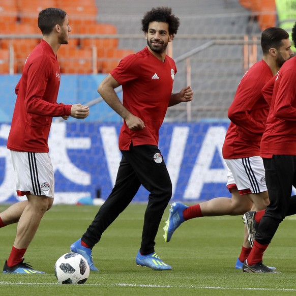 Egypt&#039;s Mohamed Salah, second left, runs with his teammates during Egypt&#039;s official training on the eve of the group A match between Egypt and Uruguay at the 2018 soccer World Cup in the Yek ...