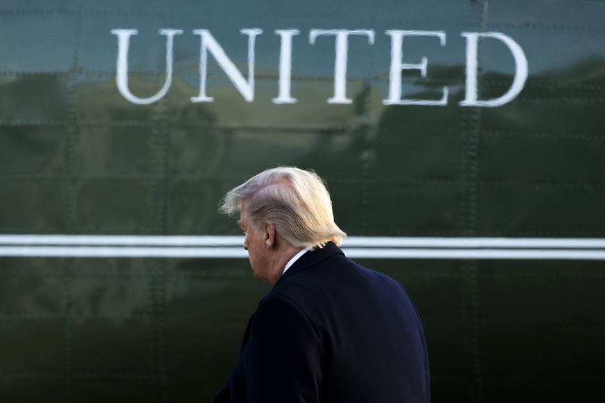 epaselect epa08115356 US President Donald J. Trump walks on the South Lawn to depart by Marine One (seen behind) en route to a rally in Ohio, in Washington, DC, USA, 09 January 2020. Trump travels to  ...