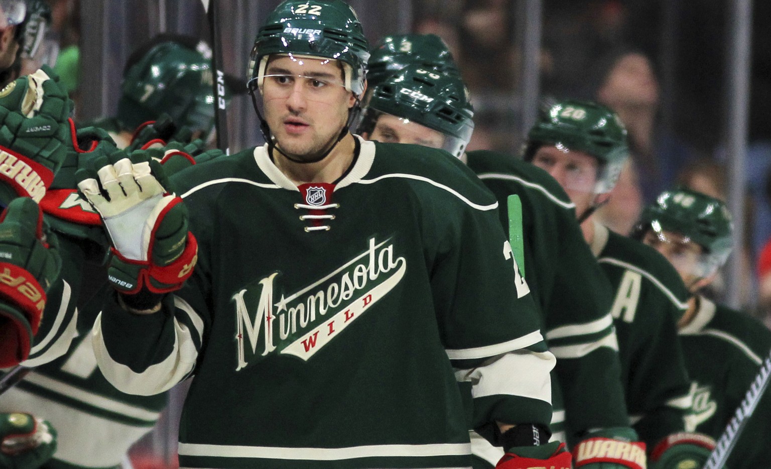 Minnesota Wild&#039;s Nino Niederreiter is congratulated by the bench after he scored a goal against the St. Louis Blues in the second period of an NHL hockey game Sunday, Dec. 11, 2016, in St. Paul,  ...