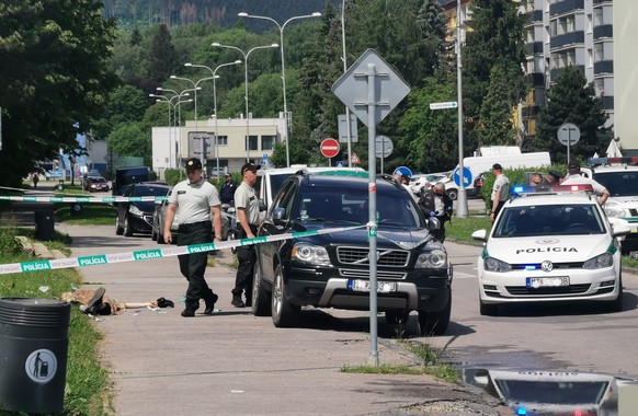 Police officers attend an incident at the primary and secondary school in Vrutky (Zilina region), Slovakia, Thursday, June 11, 2020. Police say a man with a knife attacked a school in Slovakia on Thur ...