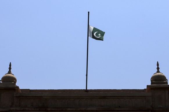 epa10699578 Pakistani national flag flies at half-mast, Pakistan 'Day of Mourning' Dozens killed in Peshawar, Pakistan, June 19, when a Greek ferry crashed.