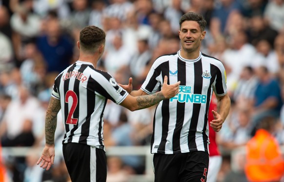 epa10108920 Newcastle's Fabian Schaer (R) celebrates with teammate Kieran Trippier (L) after scoring the 1-0 lead during the English Premier League soccer match between Newcastle United and Nottingham ...