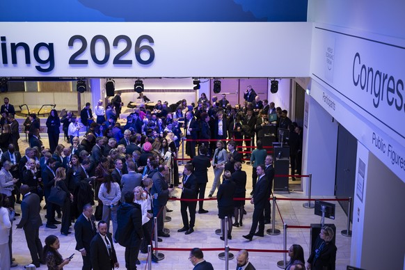 epa12667436 People queue ahead of a plenary session featuring U.S. President Donald Trump during the 56th annual meeting of the World Economic Forum (WEF) in Davos, Switzerland, 21 January 2026. The m ...