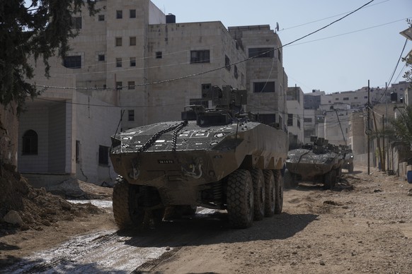 Israeli army vehicles are seen during a military operation in the West Bank city of Jenin, Tuesday, March 11, 2025. (AP Photo/Majdi Mohammed)
Israel Palestinians