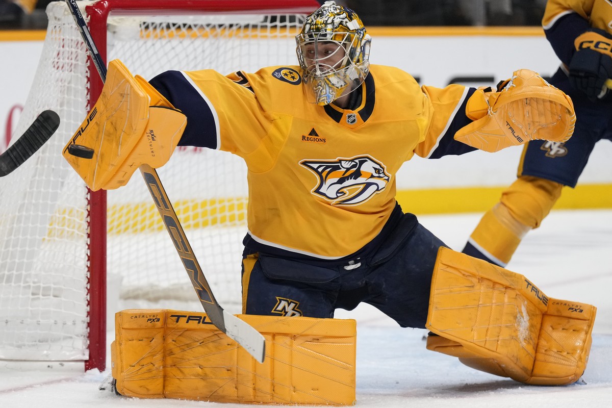 Nashville Predators goaltender Juuse Saros (74) deflects a shot on goal during the third period of an NHL hockey game against the Toronto Maple Leafs, Saturday, March 22, 2025, in Nashville, Tenn. (AP ...