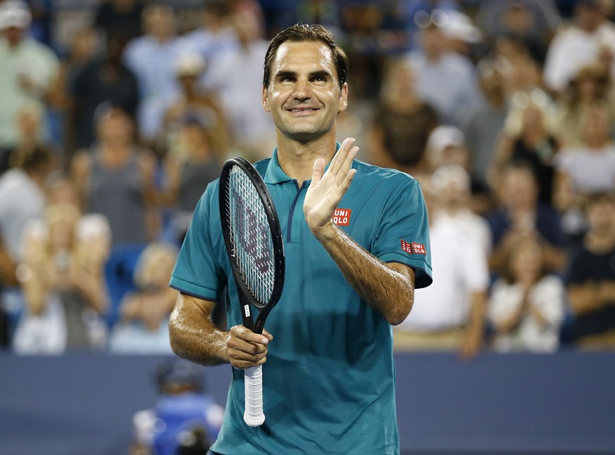 Roger Federer claps for fans as they cheer him on after defeating Juan Ignacio Londero at the Western &amp; Southern Open tennis tournament in Mason, Ohio, Tuesday, Aug. 13, 2019. (Sam Greene/The Cinc ...