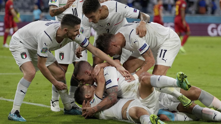 Italian teammates celebrate scoring the opening goal during the Euro 2020 soccer championship quarterfinal match between Belgium and Italy at the Allianz Arena stadium in Munich, Germany, Friday, July ...