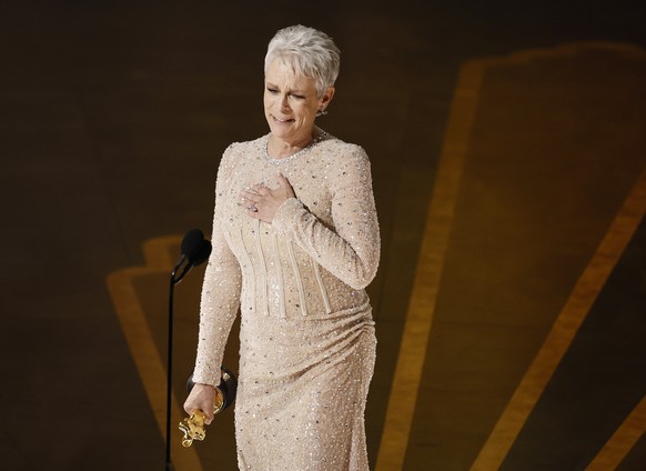 epa10518507 Jamie Lee Curtis celebrates after winning the Oscar for Actress in a Supporting Role for &#039;Everything Everywhere All at Once&#039; during the 95th annual Academy Awards ceremony at the ...