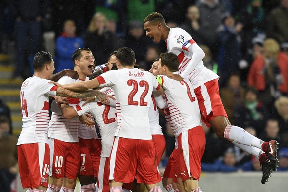 Switzerland&#039;s soccer players celebrate the 0:1 scoring by Switzerland&#039;s defender Ricardo Rodriguez, during the 2018 Fifa World Cup play-offs first leg soccer match Northern Ireland against S ...