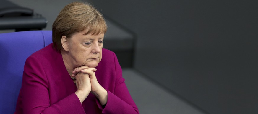 German Chancellor Angela Merkel, right, attends a debate on &#039;70 Years German Constitution&#039; of the German federal parliament, Bundestag, at the Reichstag building in Berlin, Germany, Thursday ...