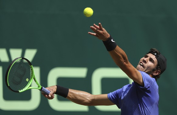 Russia&#039;s Karen Khachanov serves a ball to Japan&#039;s Kei Nishikori during their match at the Gerry Weber Open tennis tournament, in Halle, Germany, Thursday, June 22, 2017. (Friso Gentsch/dpa v ...