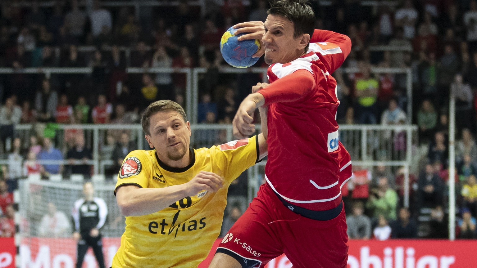 Switzerland&#039;s Andre Schmid, right, in action against Belgium&#039;s Nicolas Danse during the 2020 Men&#039;s European Championship qualification game between Switzerland and Belgium at the BBC Ar ...