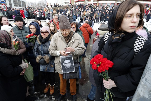 epa11191328 People react outside the Church of the Icon of the Mother of God, prior the funeral of late Russian opposition leader Alexei Navalny, in Moscow, Russia, 01 March 2024. Outspoken Kremlin cr ...