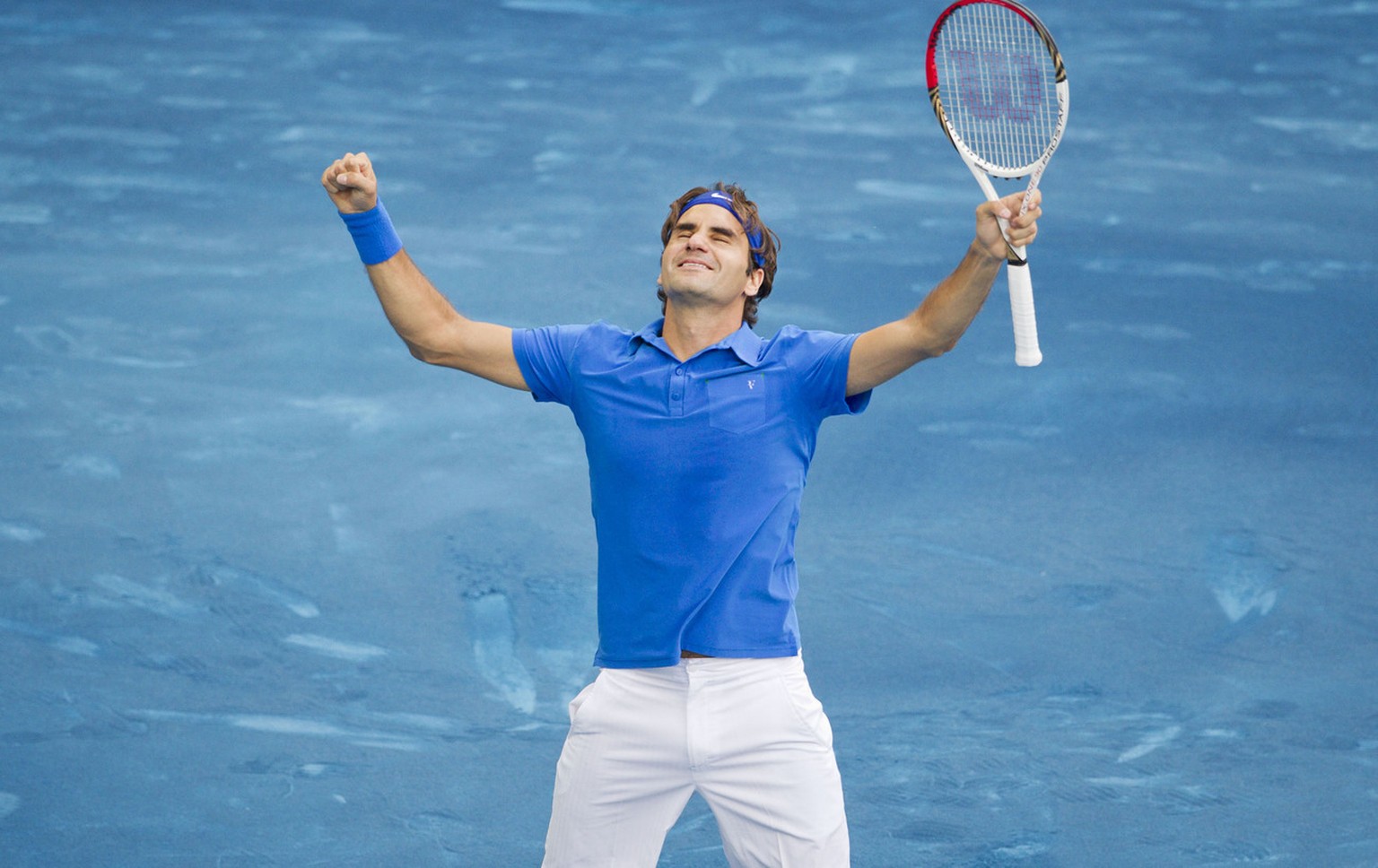 Roger Federer from Switzerland celebrates after defeating Tomas Berdych from the Czech Republic during their singles men's final tennis match at the Madrid Open tennis tournament in Madrid Sunday ...