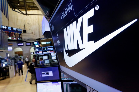 FILE - The Nike logo appears above the post where it trades on the floor of the New York Stock Exchange, March 22, 2017. (AP Photo/Richard Drew, File)
Nike Discrimination Complaint