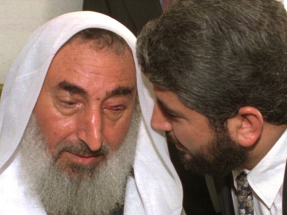 Sheikh Ahmad Yassin founder of the militant group Hamas talking on Monday October 6, 1997 with Khalid Mashaal head of the Hamas political bureau who was attacked by two Mossad agents on September 25,  ...
