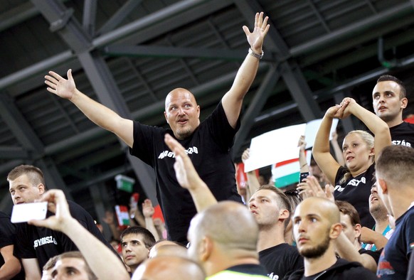 Supporters of Hungary react before a Euro 2016 qualifying soccer match between Hungary and Romania at Groupama Arena in Budapest, Hungary, September 4, 2015. Football fans clashed with migrants earlie ...