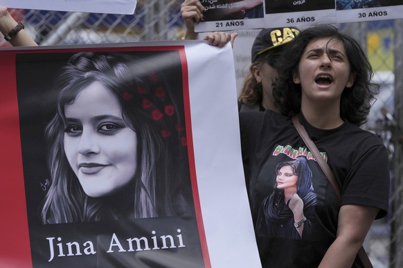 Iranian nationals living in Ecuador protest against the death of Mahsa Amini, a 22-year-old who died in Iran while in police custody, in front of the Foreign Ministry building in Quito, Ecuador, Wedne ...