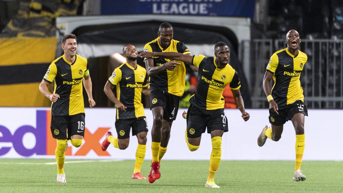Young Boys' Ulisses Garcia, 2nd right, celebrates with teanmates after scoring to 3:1 during the UEFA Champions League Play-off first leg soccer match between BSC Young Boys and Ferencvaros TC, o ...