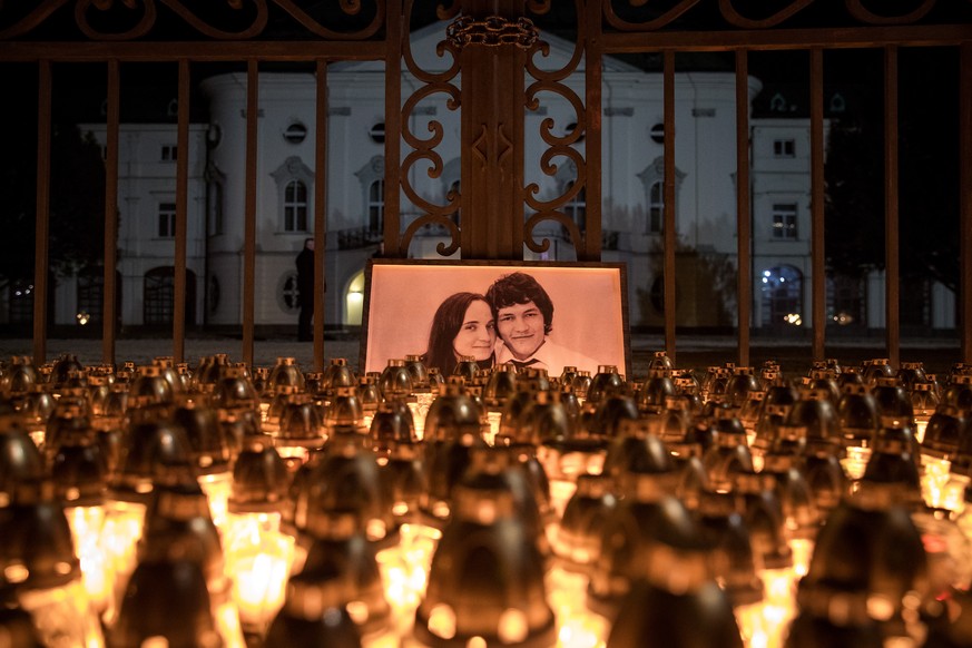 epa07501244 (FILE) - Candles are placed during a march in memory of murdered Slovak journalist Jan Kuciak and his fiancee Martina Kusnirova, in front of the Slovak government building in Bratislava, S ...