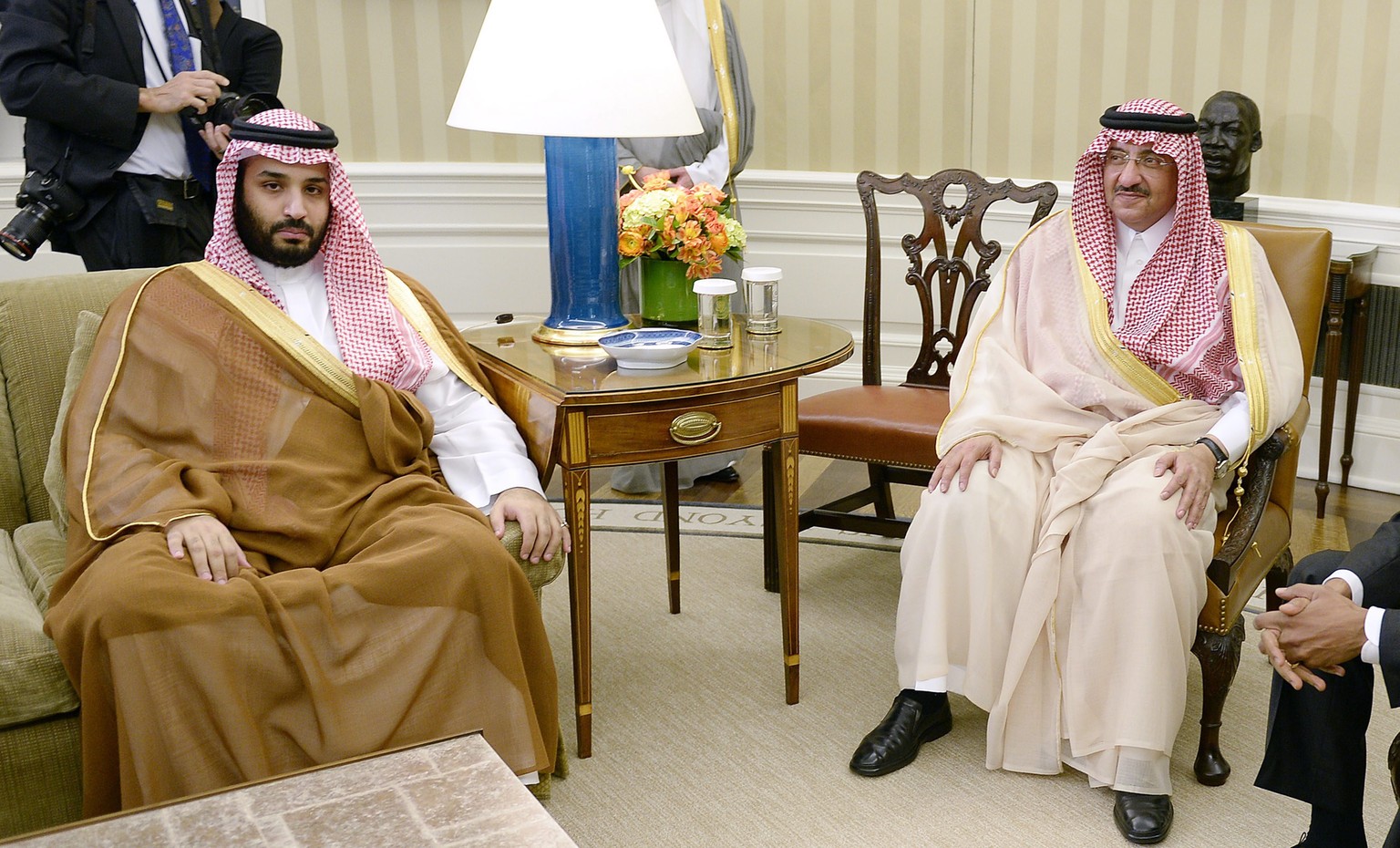 epa04746657 Crown Prince Mohammed bin Nayef (R) and Deputy Crown Prince Mohammed bin Salman (L) of Saudi Arabia look on during a bilateral meeting with US President Barack Obama in the Oval Office of  ...