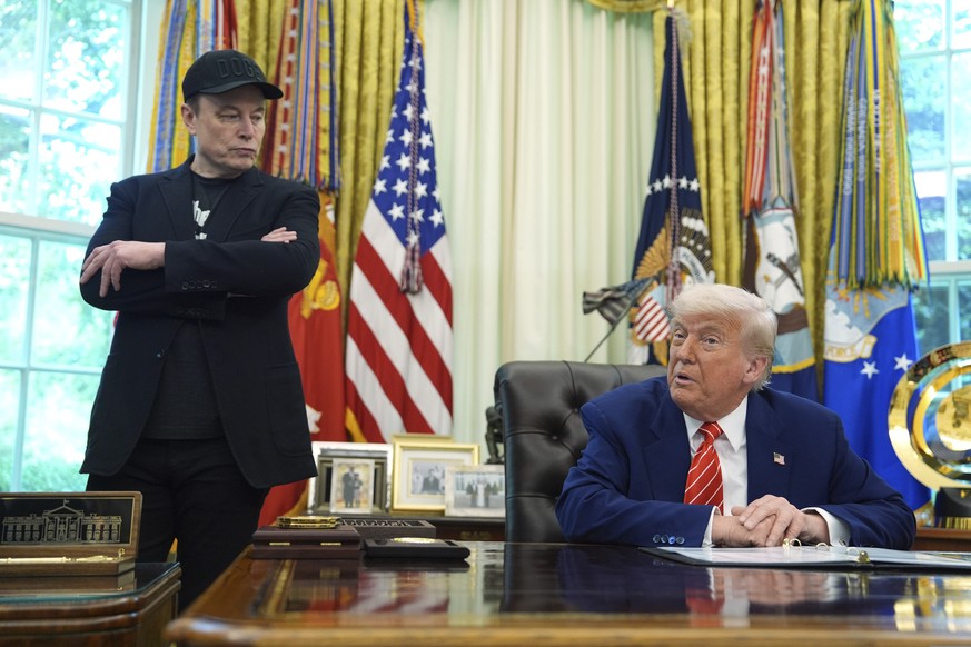 FILE - President Donald Trump, right, speaks during a news conference with Elon Musk in the Oval Office of the White House, Friday, May 30, 2025, in Washington. (AP Photo/Evan Vucci, File)
Donald Trum ...