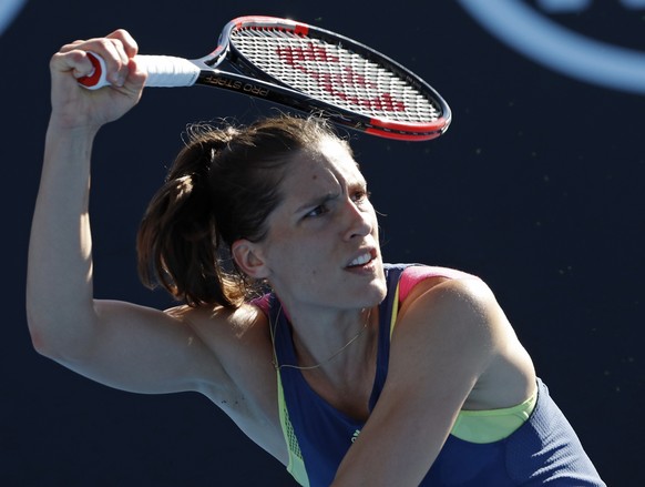 Germany&#039;s Andrea Petkovic follows through on a shot to Petra Kvitova of the Czech Republic during their first round match at the Australian Open tennis championships in Melbourne, Australia, Tues ...