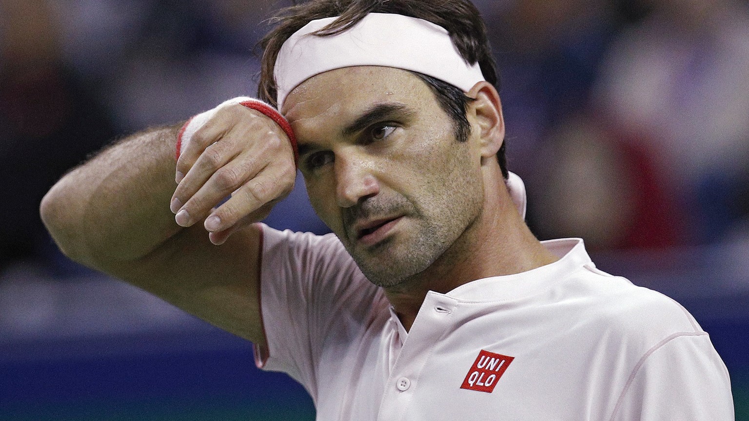 Roger Federer of Switzerland reacts during his during his men&#039;s singles quarterfinals match against Kei Nishikori of Japan in the Shanghai Masters tennis tournament at Qizhong Forest Sports City  ...