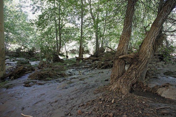 The creek under the First Crossing Bridge is seen Sunday afternoon, July 16, 2017, following a deadly flash-flooding that ripped through Saturday in the Tonto National Forest, Ariz. The flooding came ...