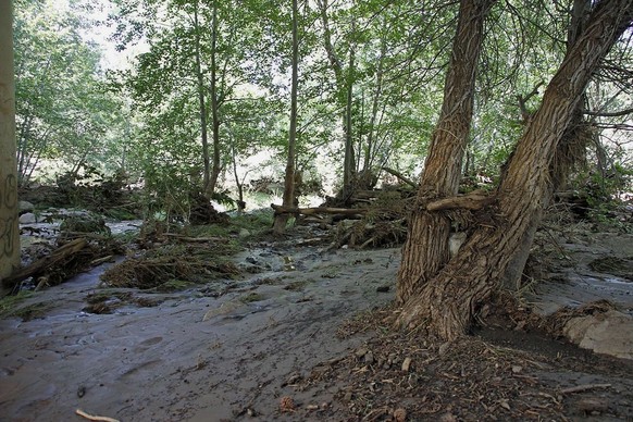 The creek under the First Crossing Bridge is seen Sunday afternoon, July 16, 2017, following a deadly flash-flooding that ripped through Saturday in the Tonto National Forest, Ariz. The flooding came  ...