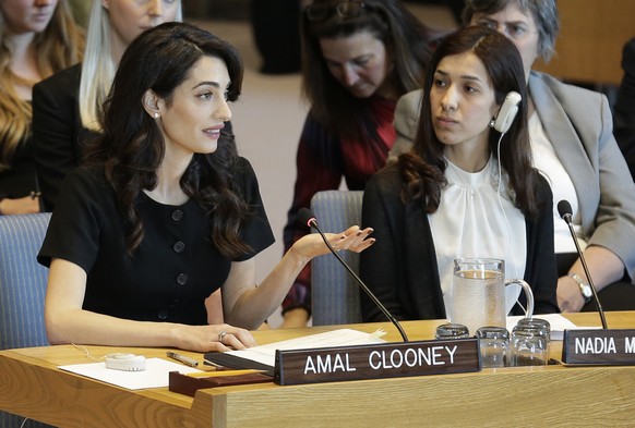 While Nadia Murad Basee Taha, right, listens, Amal Clooney speaks during a Security Council meeting on sexual violence at United Nations headquarters, Tuesday, April 23, 2019. (AP Photo/Seth Wenig)