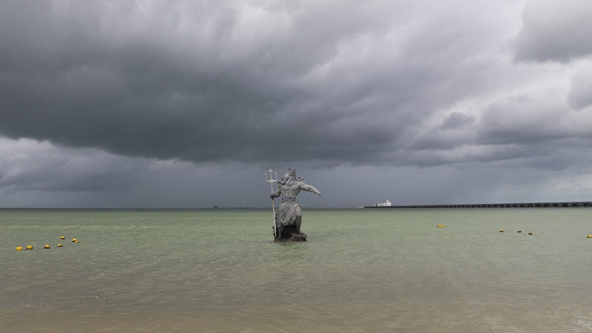 A sculpture of Poseidon stands in the ocean before the arrival of Hurricane Milton in Progreso, Yucatan state, Mexico, Monday, Oct. 7, 2024. (AP Photo/Martin Zetina)