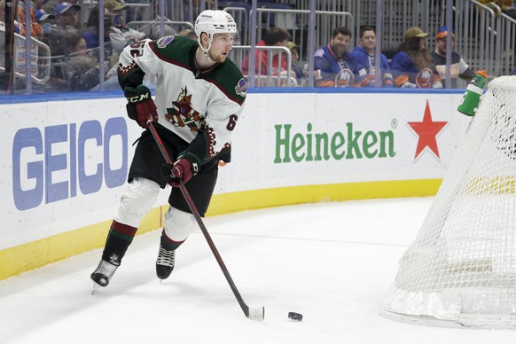 Arizona Coyotes defenseman Janis Moser (62) skates around the goal during the second period of the team&#039;s NHL hockey game against the New York Islanders, Friday, Jan. 21, 2022, in Elmont, N.Y. (A ...
