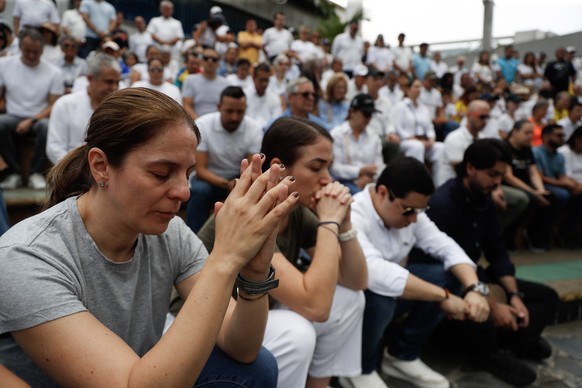 epa12164402 People participate in a demonstration in Cali, Colombia, 08 June 2025. In several Colombian cities citizens took to the streets to pray for the recovery of senator and presidential pre-can ...