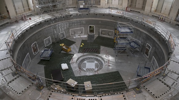 The base of the cryostat sits inside the bioshield of the ITER Tokamak in Saint-Paul-Lez-Durance, southern France, Tuesday, July 28, 2020. A project of daunting proportions and giant ambitions replica ...