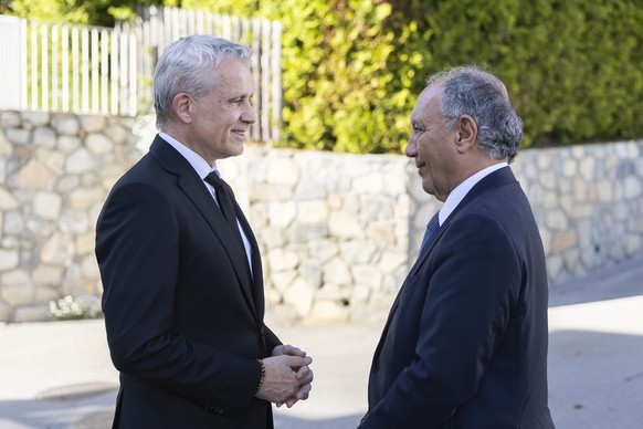 epa13009613 Gian Lorenzo Cornado (L), Ambassador of Italy to Switzerland and Liechtenstein, and Swiss Federal Councillor Beat Jans (R) attend the tribute concert Hommage aux Anges de Crans-Montana at  ...