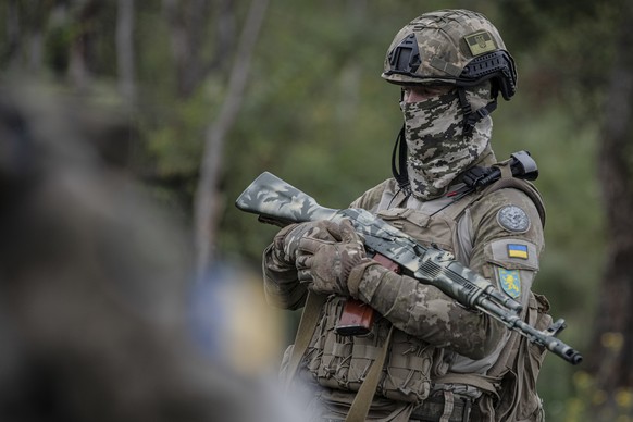 A volunteer soldier attends a training outside Kyiv, Ukraine, Saturday, Aug. 27, 2022. Some volunteers signed up to join a Chechen unit that fights alongside the Ukrainian military. Fighters from Chec ...